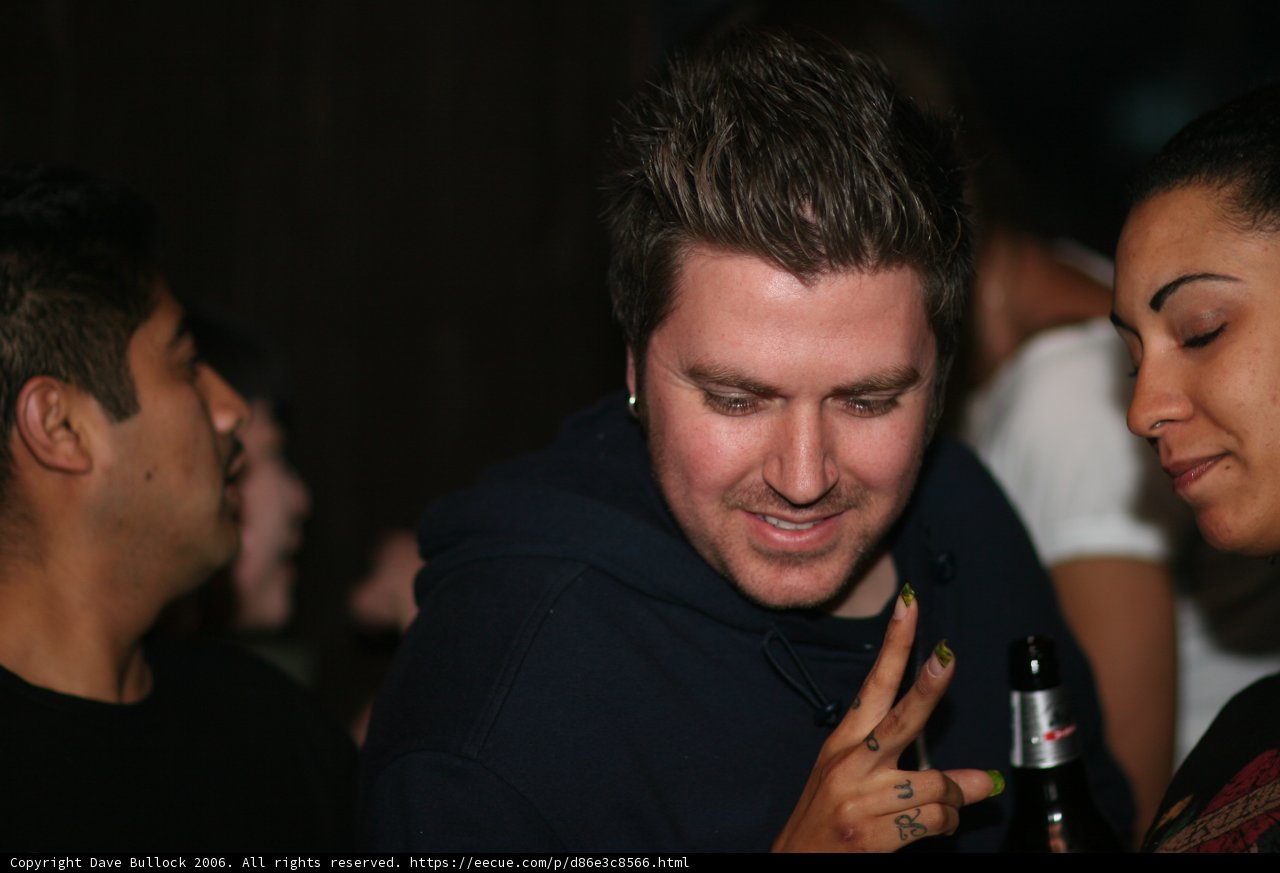 Man in Black Hoodie with Beer Bottle