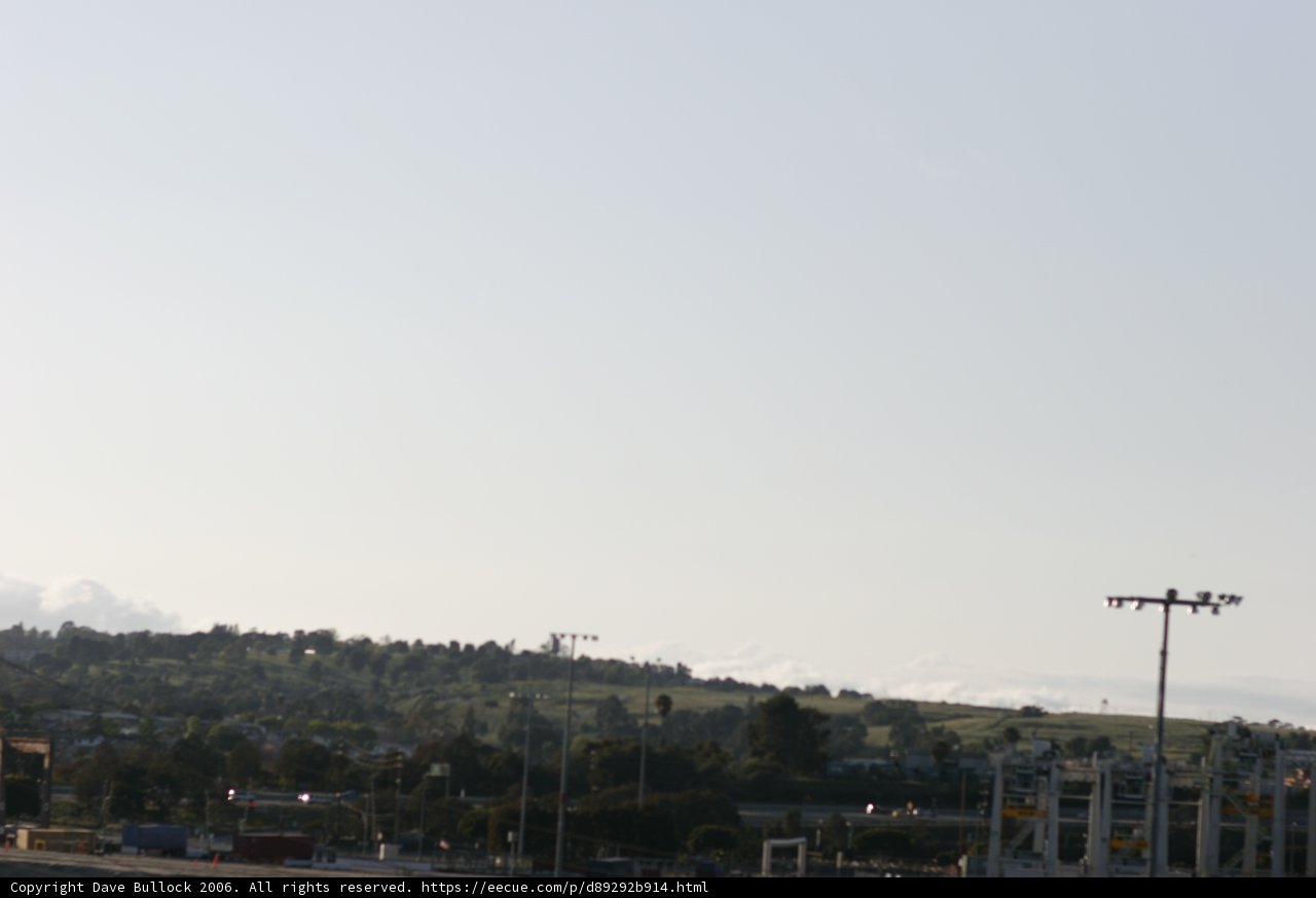 Aerial View of City with Hill in Background