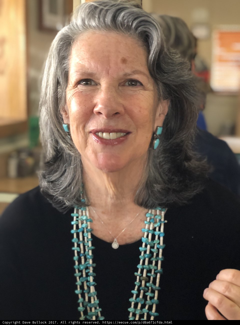 Gray-Haired Woman with Prayer Beads Necklace