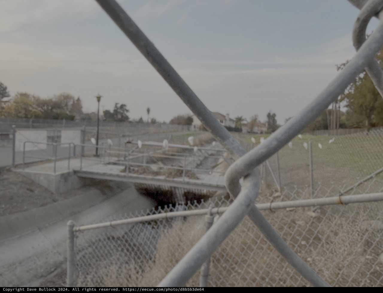 View Through Chain Link Fence of Industrial Site