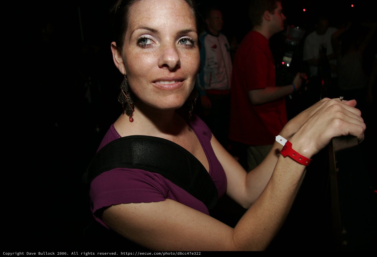 Woman at Nightclub Event Displaying Entry Wristband