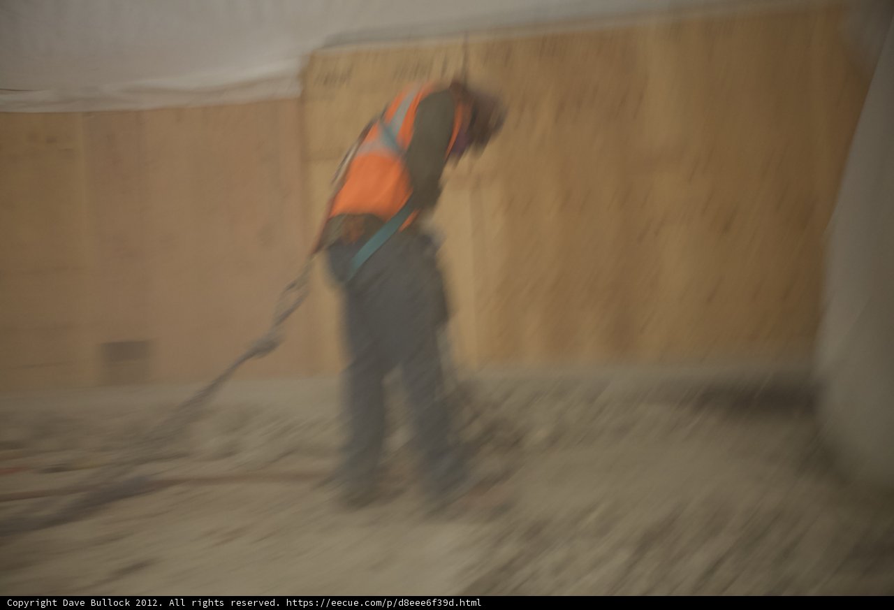Plywood Worker on Concrete Floor