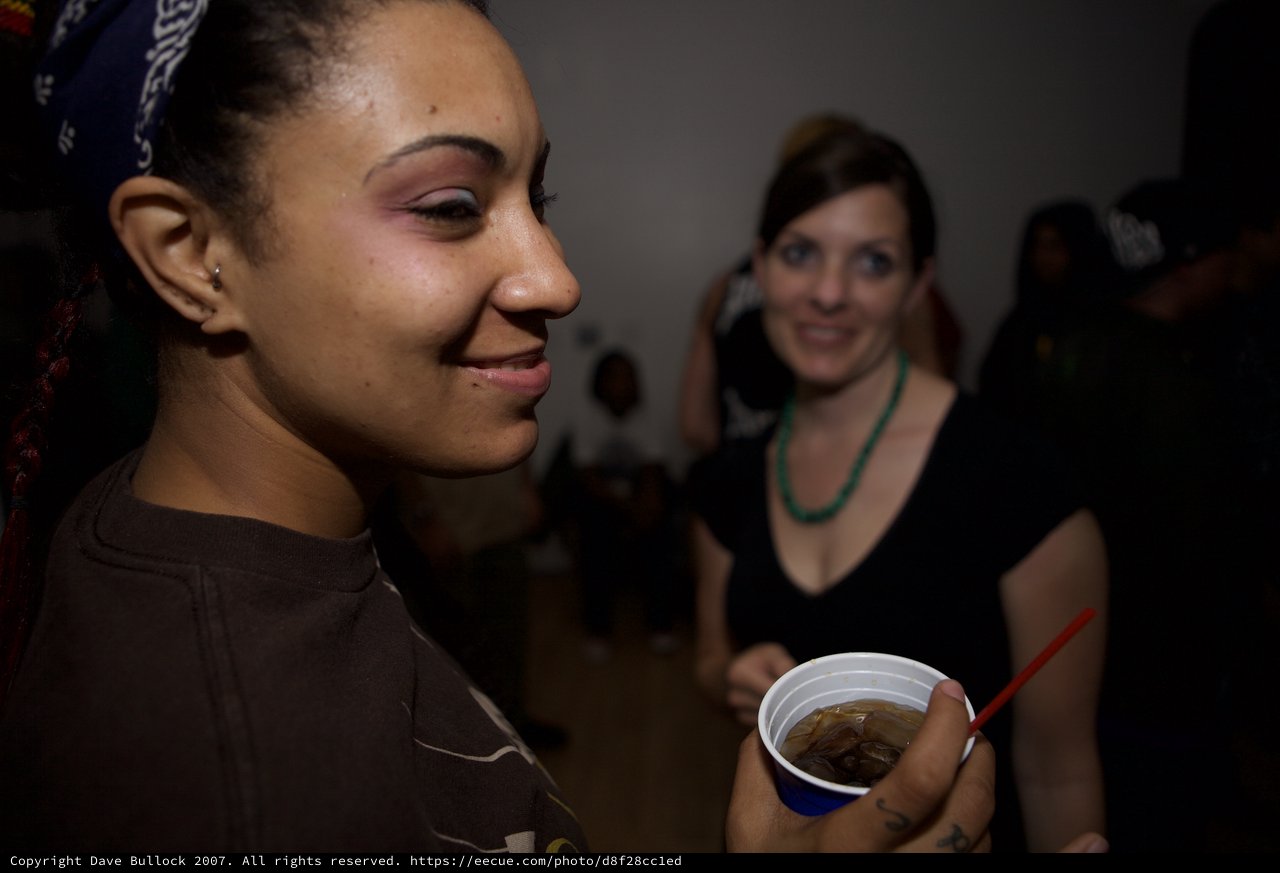 Two Women Smiling at a Late-Night Dubstep Event