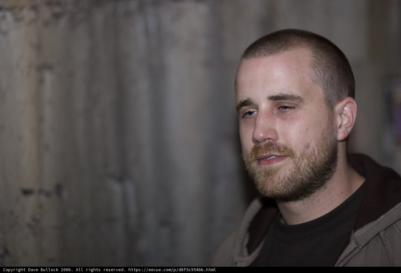 Hooded Man Contemplates