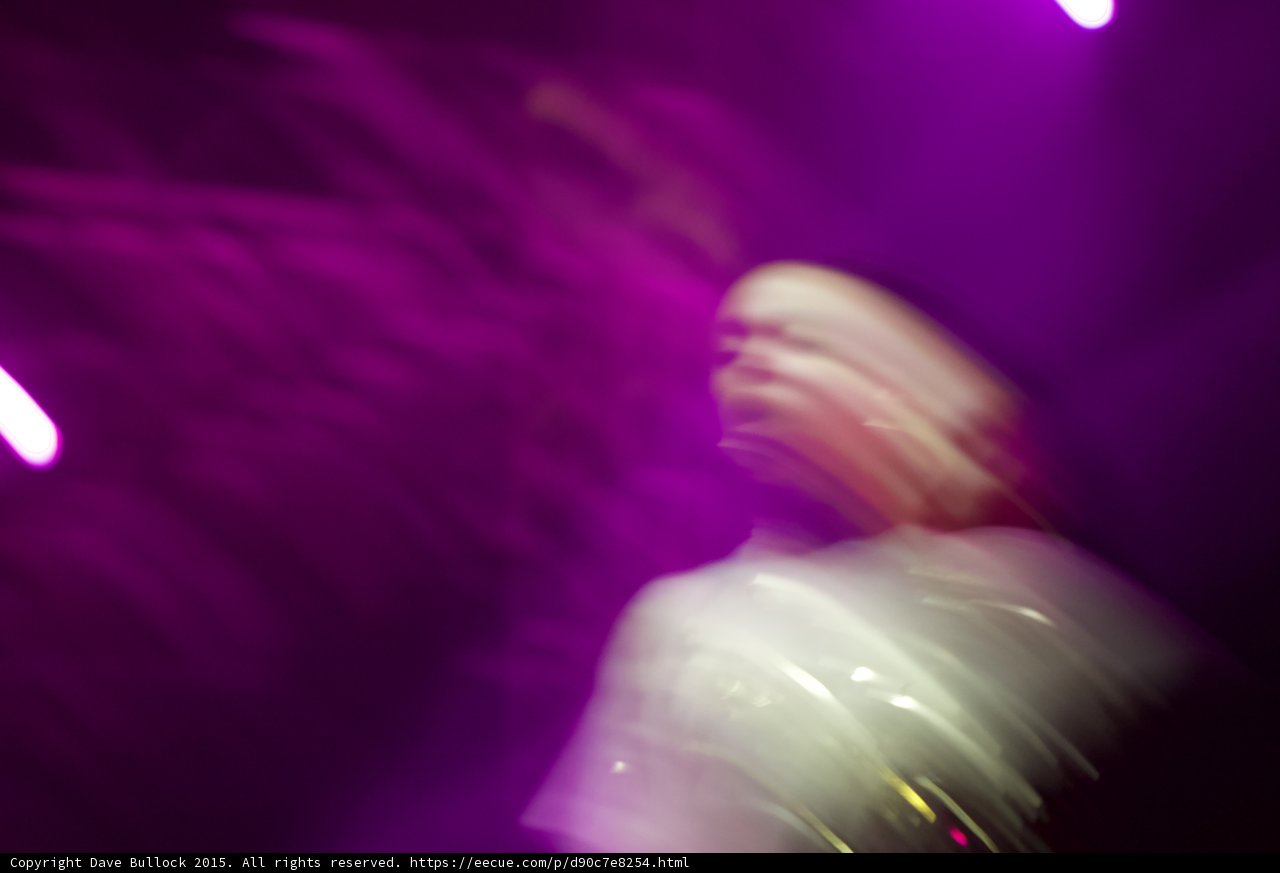 Blurred Spotlight on a Concertgoer