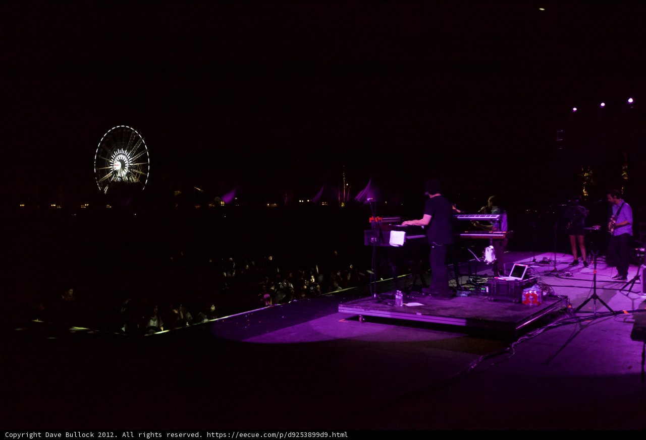 Nighttime Concert with Ferris Wheel in the Background