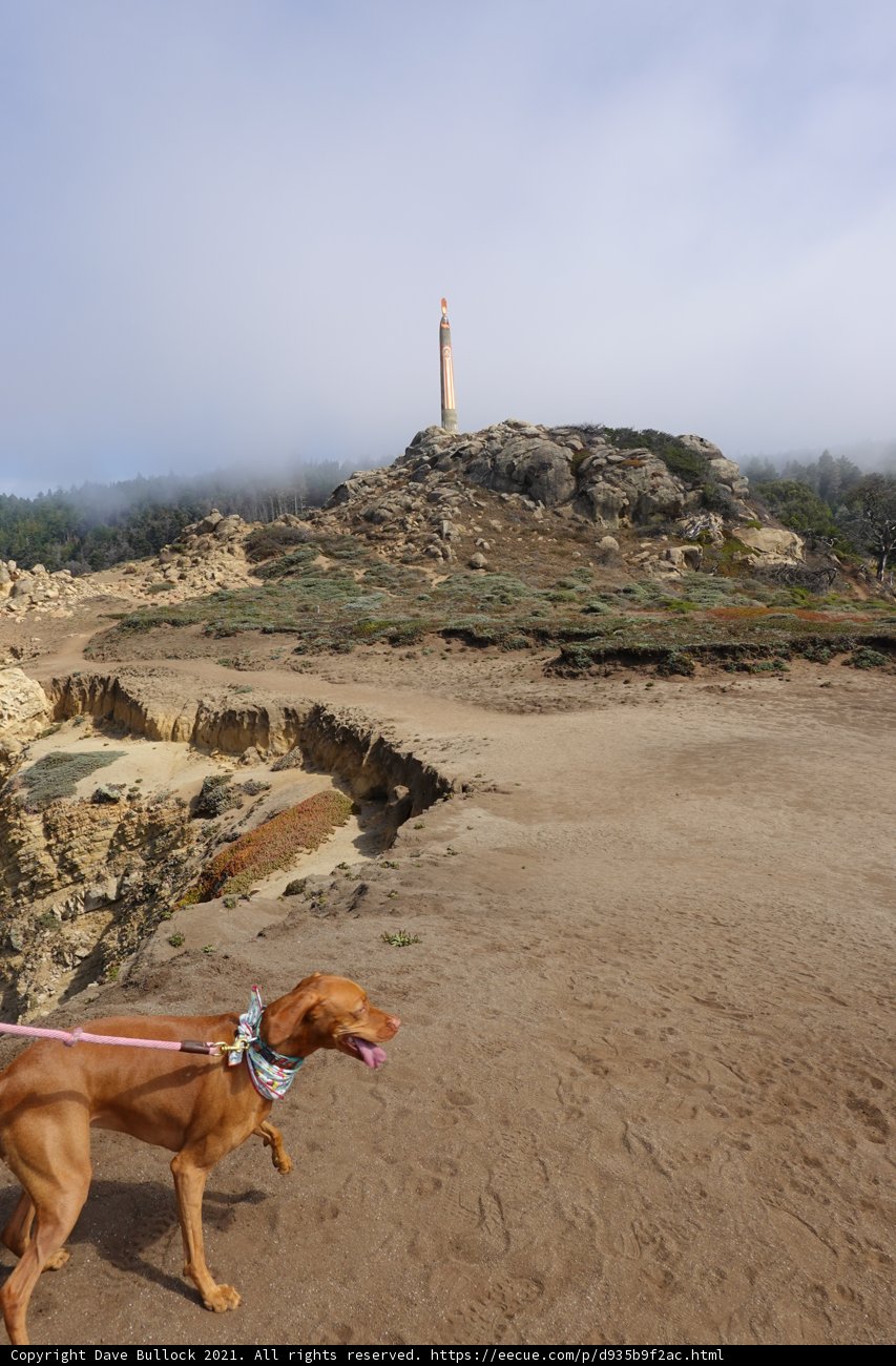 Beach Walk with a Lighthouse View