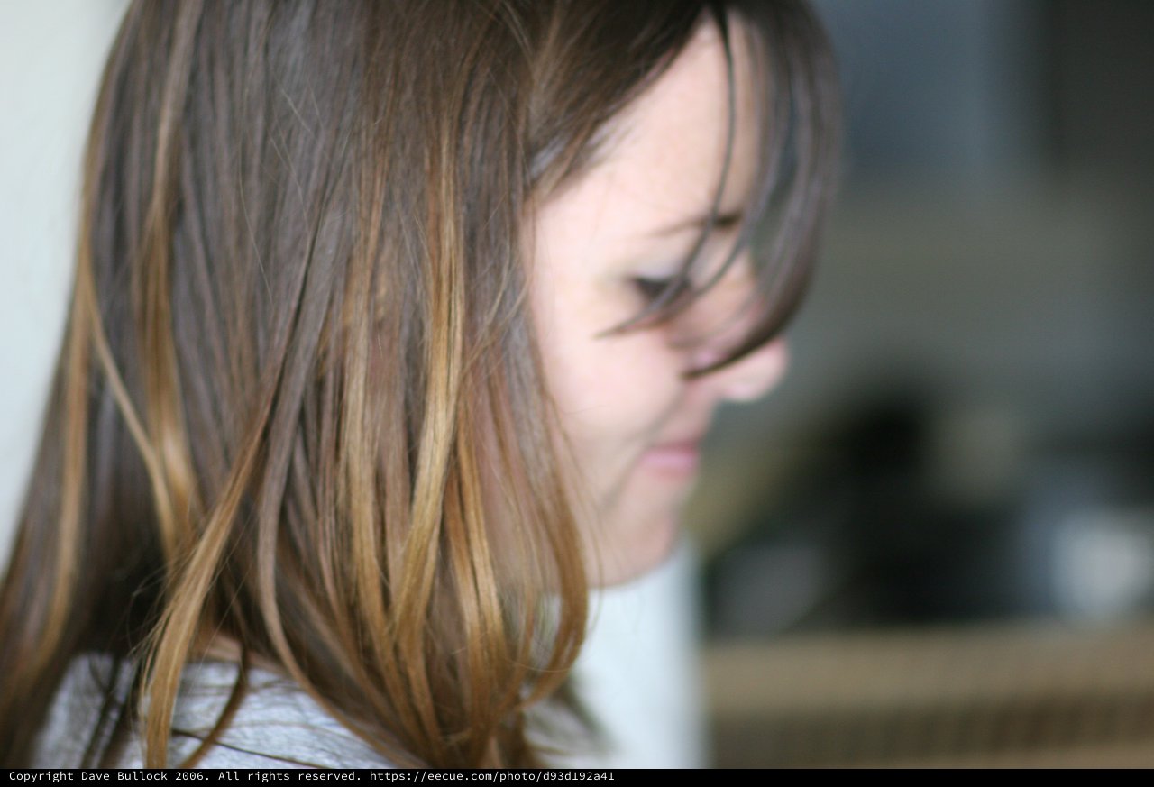 Young Girl Lost in Thought, Hair Falling Forward