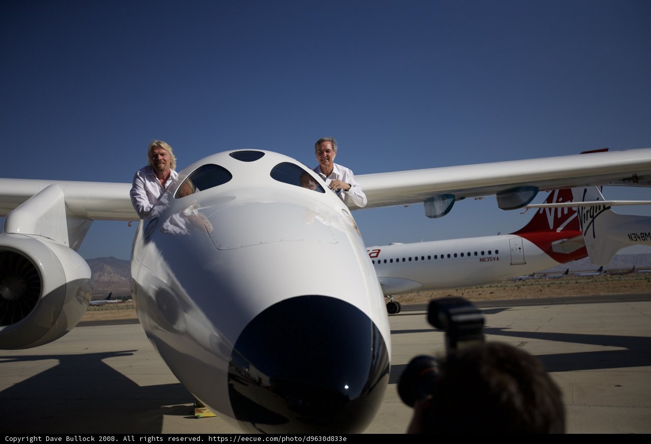 Standing Proudly with their Plane