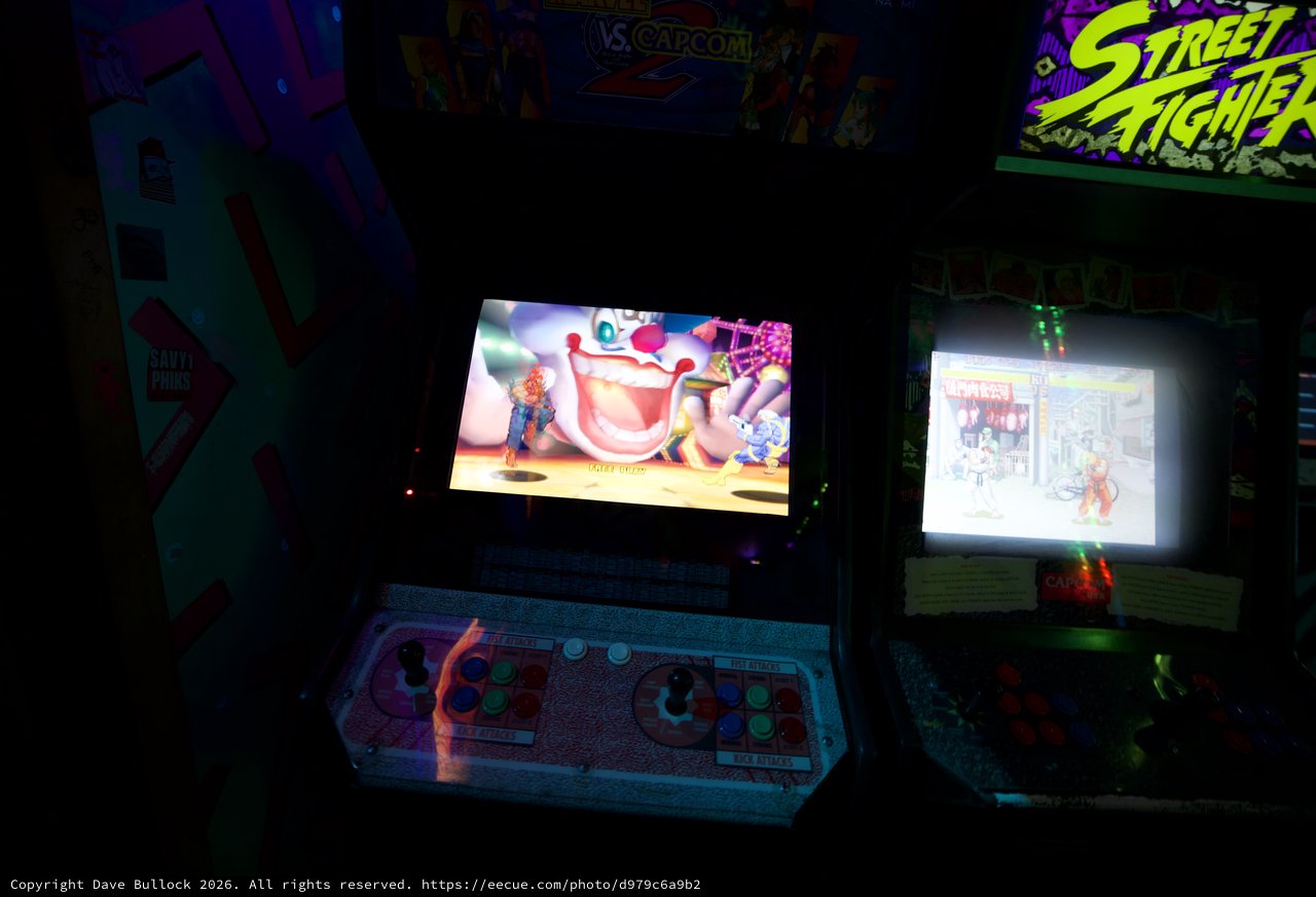 Classic Arcade Gaming Setup with Street Fighter Cabinets