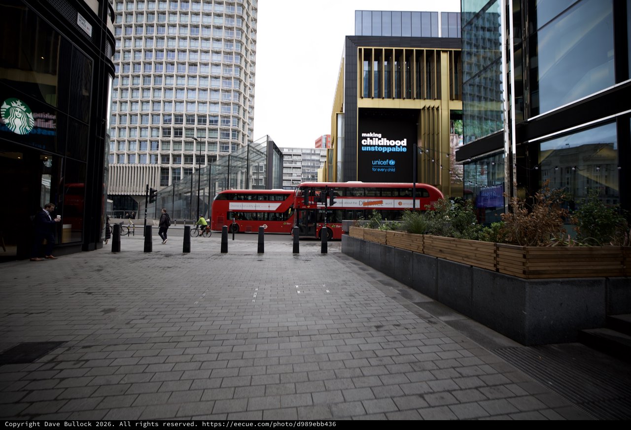 Modern London Plaza with Red Double-Decker Bus