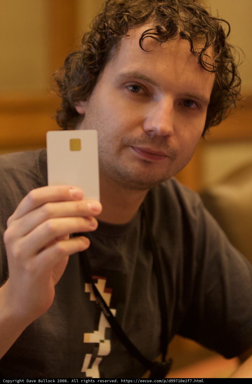 Black Shirted Man Using Mobile Phone