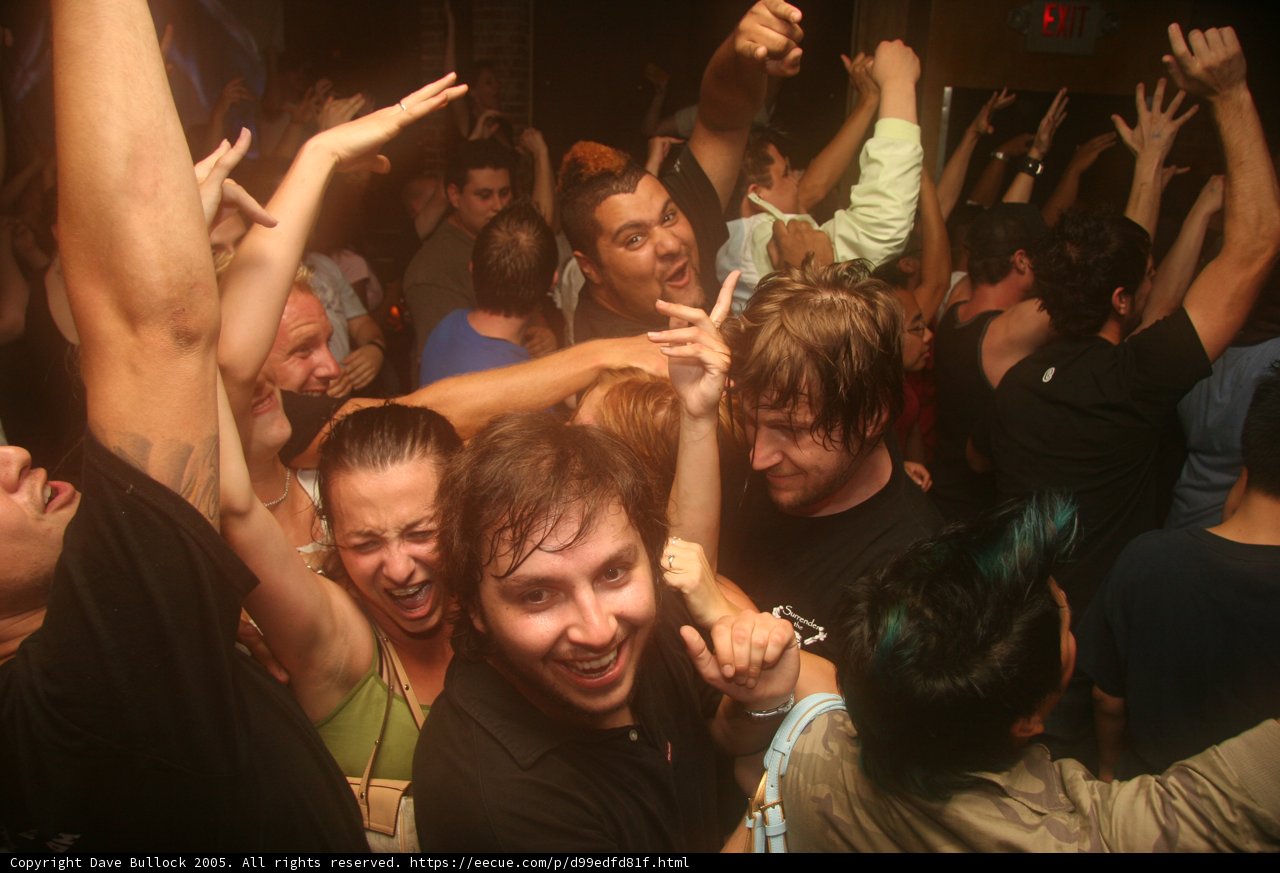 Hand in the air at a lively party