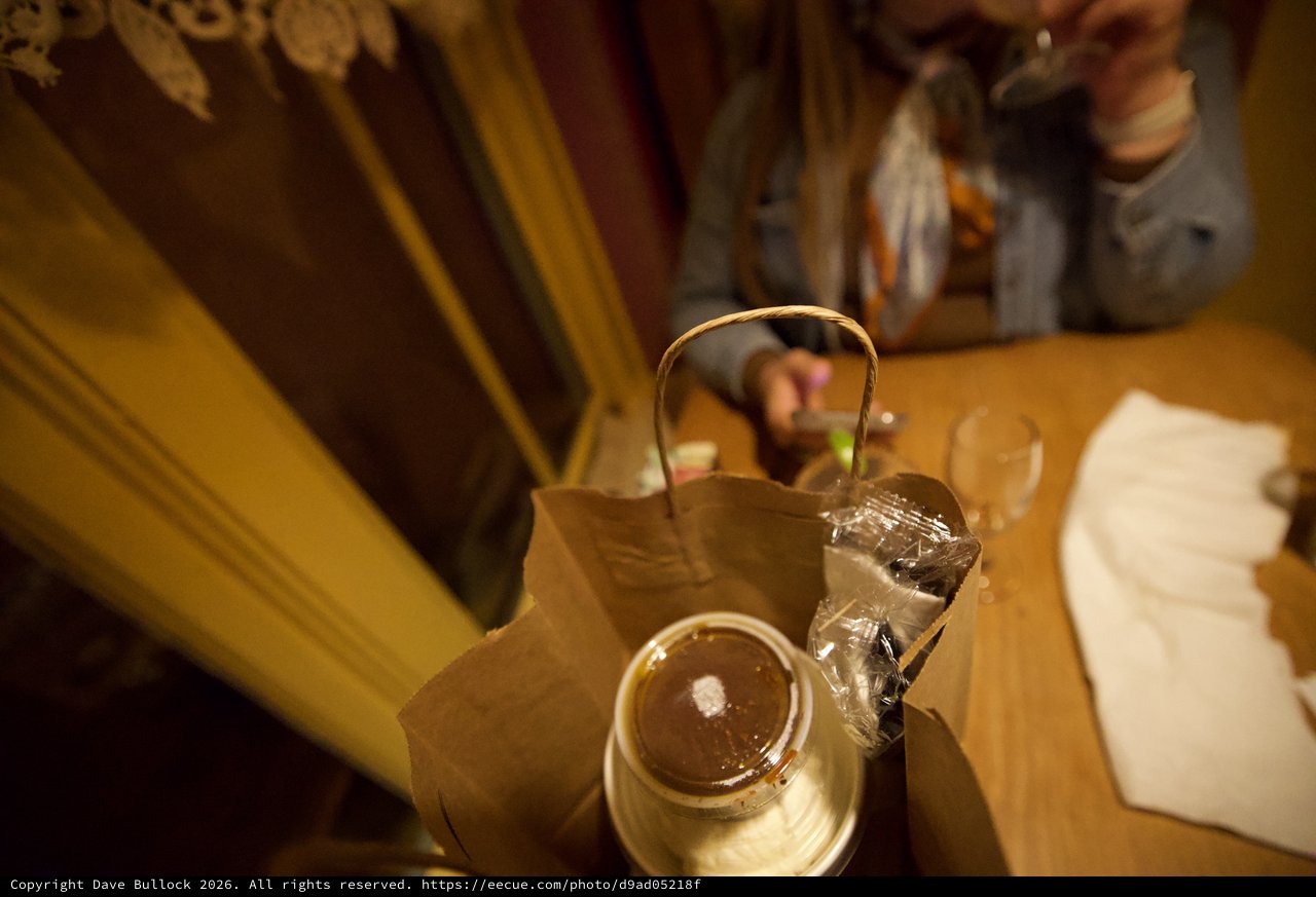 Takeout Dinner and Teapot on Restaurant Table