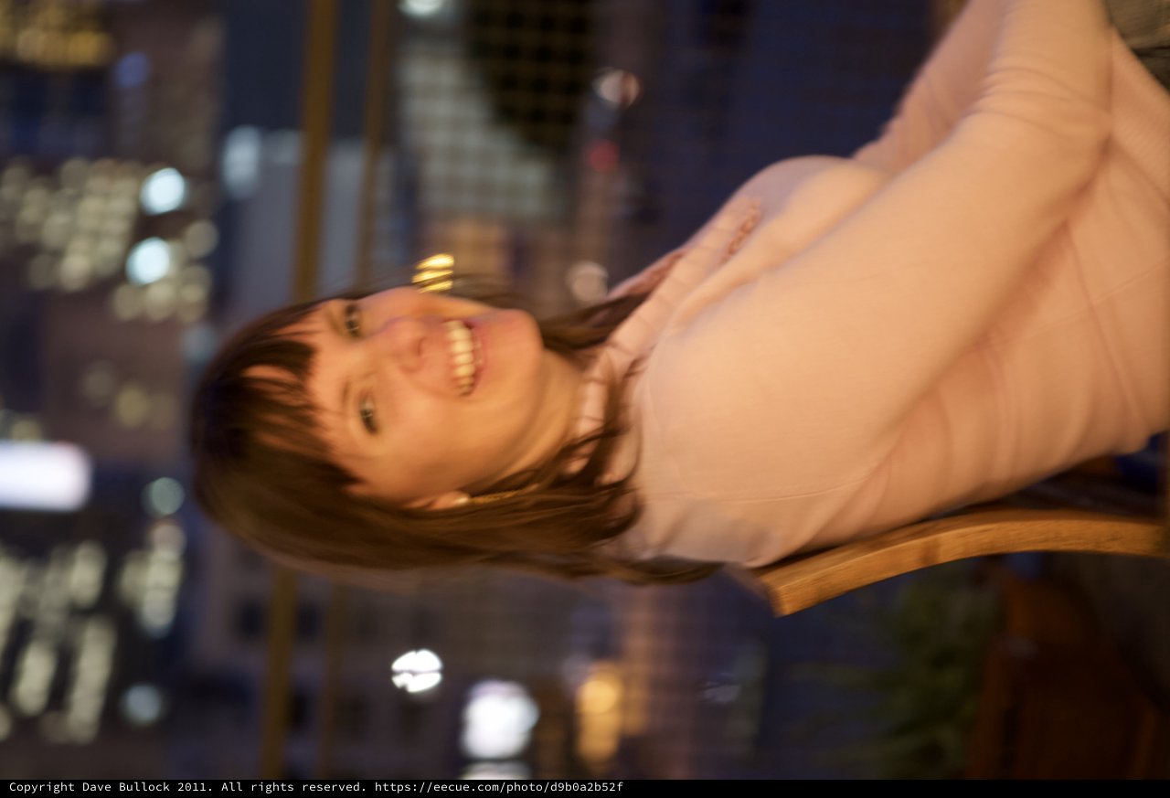 Joyful Woman Laughing at Night in the City