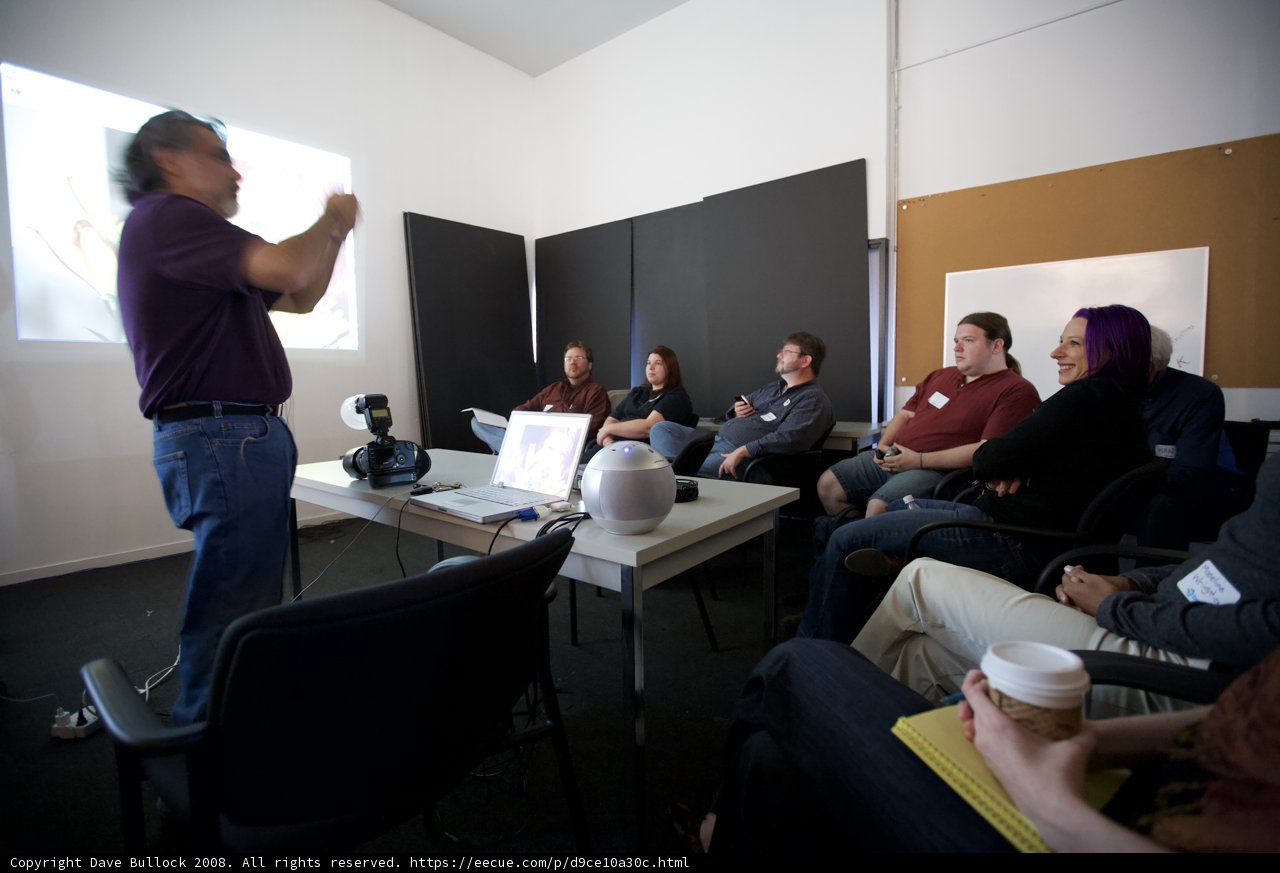 Man Giving Presentation to Large Audience
