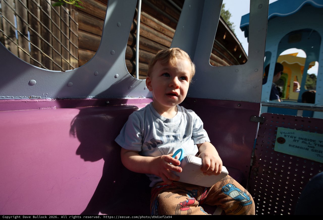 Toddler at Colorful Playground in Fantasyland
