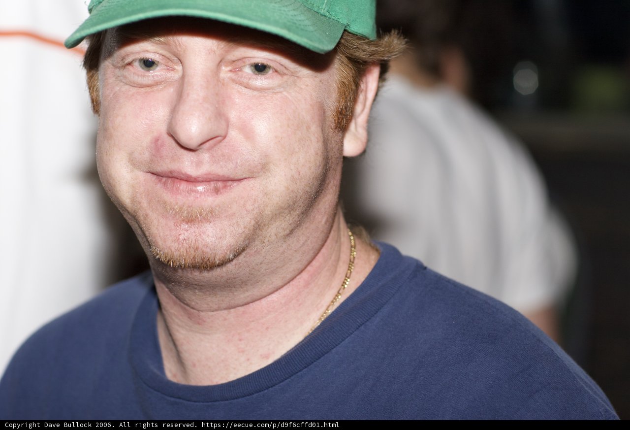 Happy Man in Green Baseball Cap