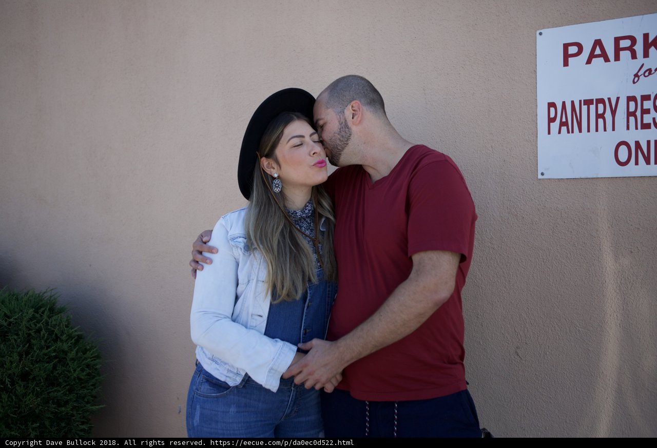 A Romantic Kiss by the Pantry Sign