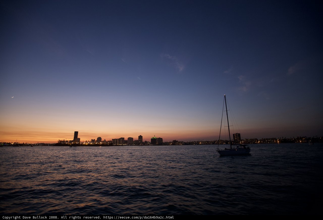 Sunset Sailboat on the City Skyline