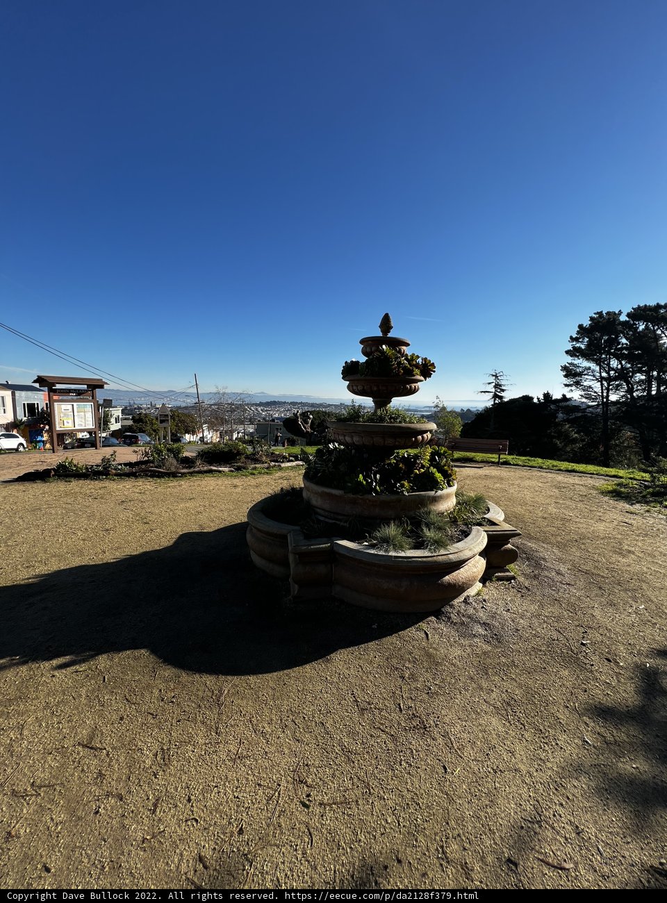 Serene Cityscape from a Park Fountain