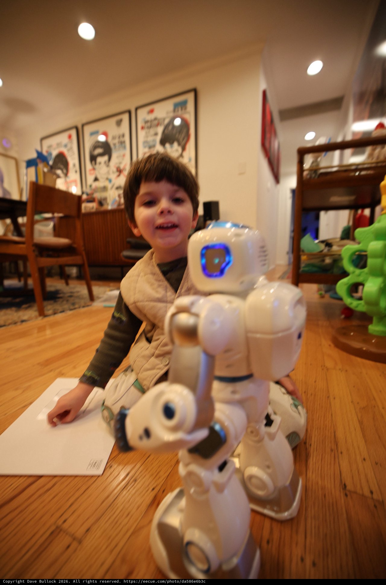 Child Playing with Robot Toy at Home