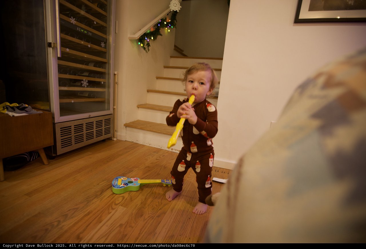 Toddler Playing Yellow Recorder on Christmas Day