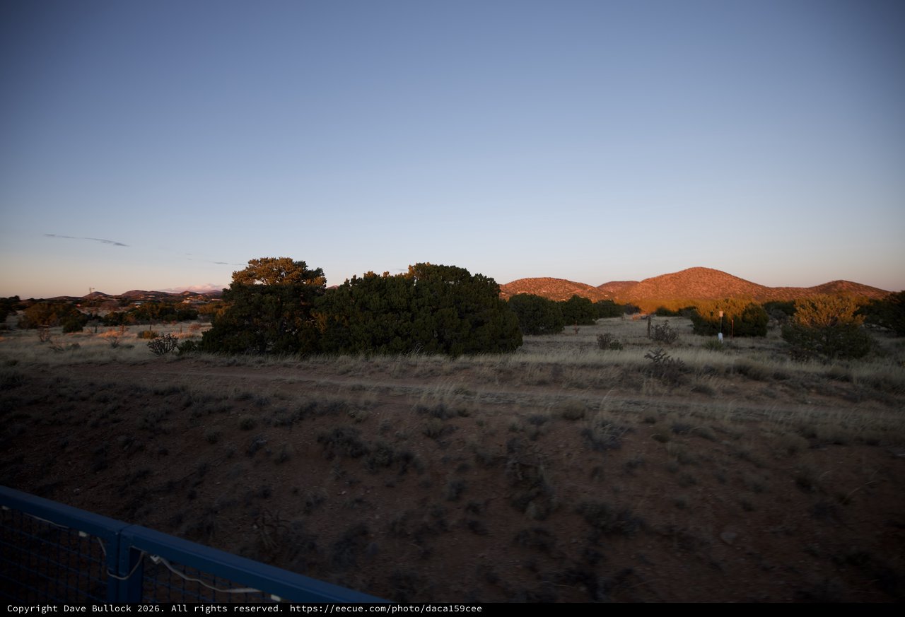 Desert Sunset Over Hills and Scrubland