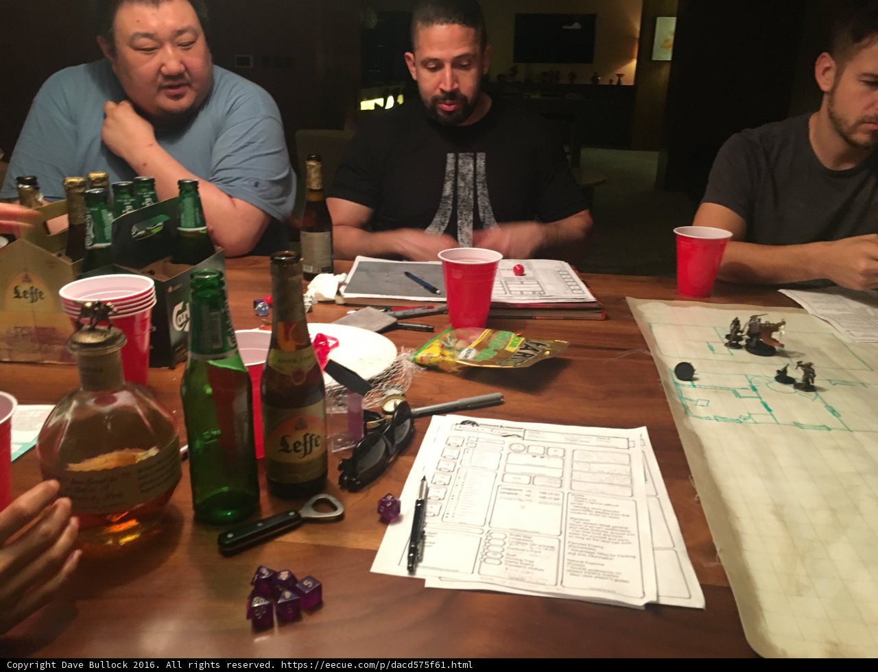 Group of Men Enjoying Beer and Papers at the Pub