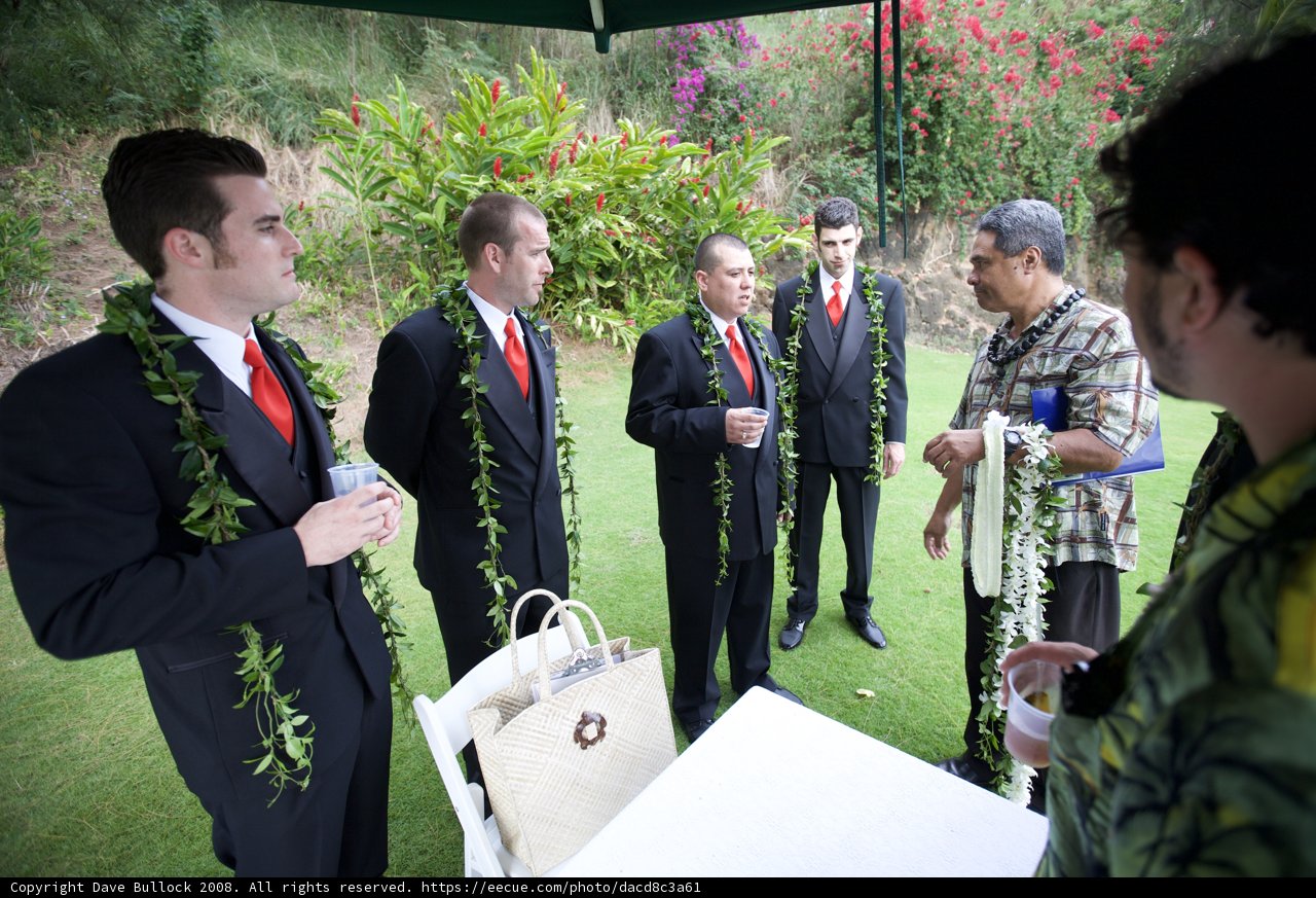 Groomsmen in Suits with Flower Bouquets