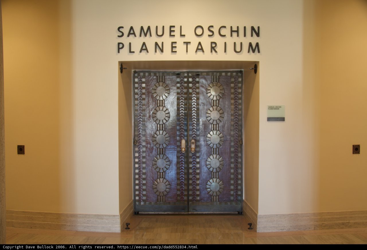 Samuel Oshin Planetarium's stylish wooden doorway