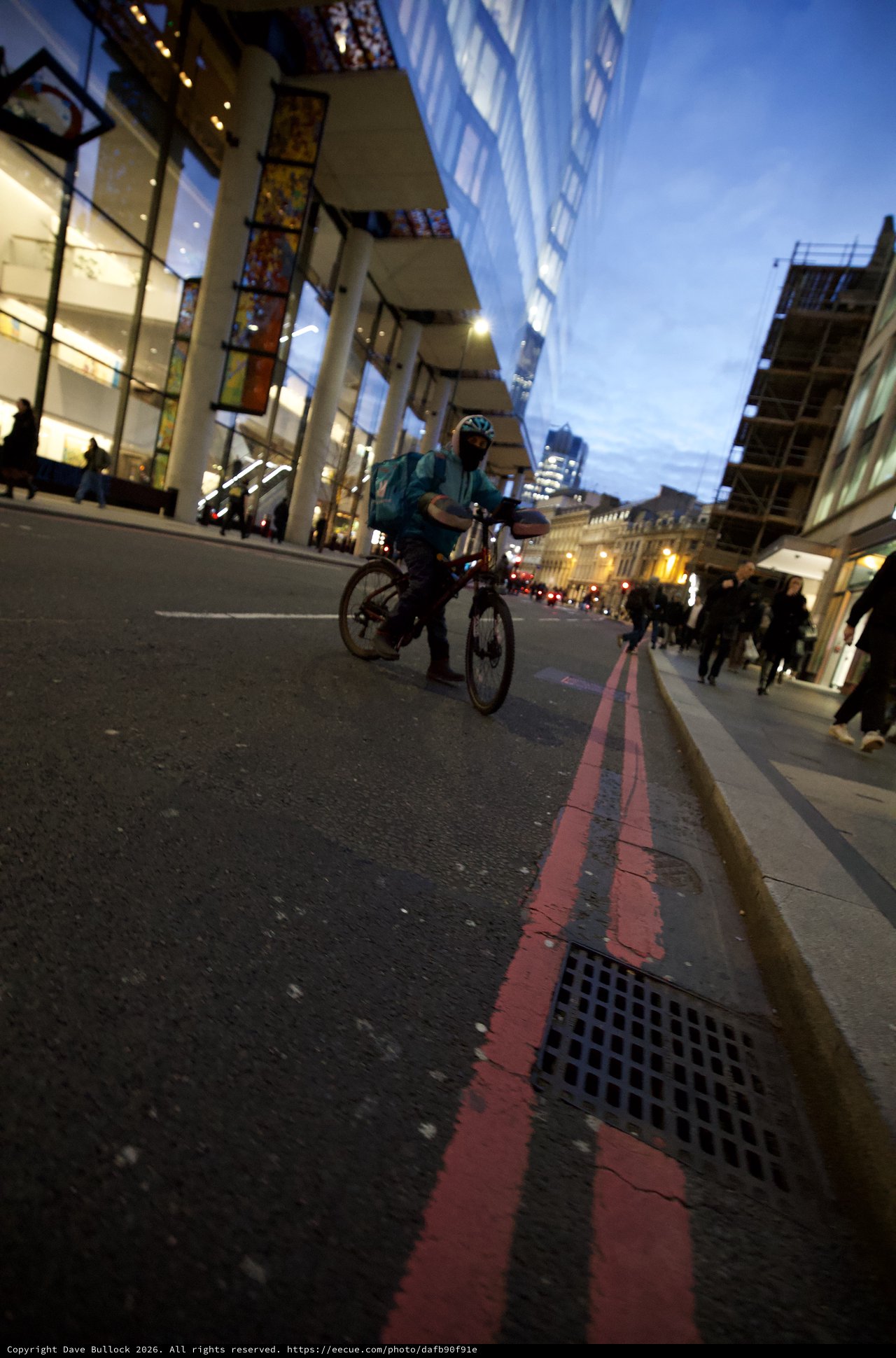 Evening Cyclist on London's Red Route at Twilight