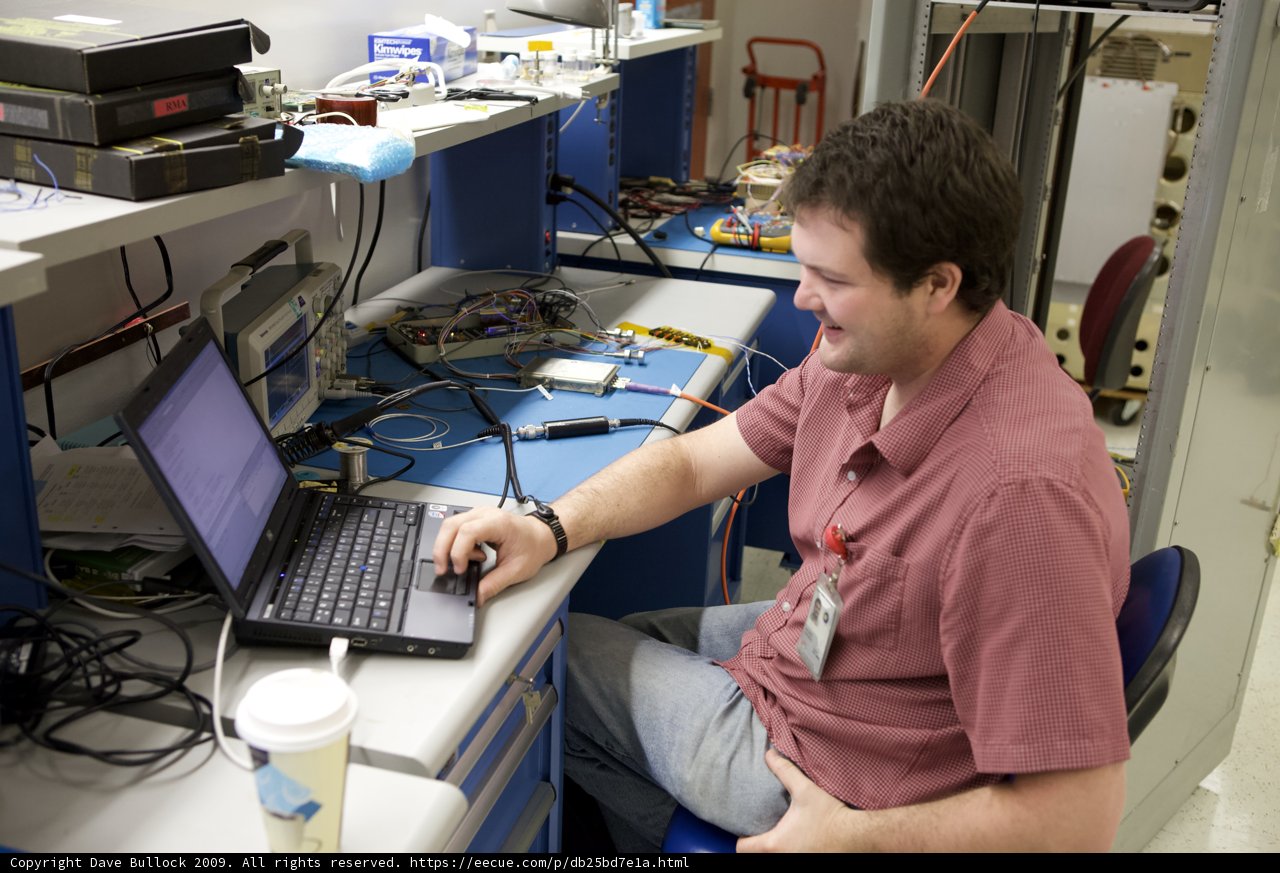 Red Shirted Man at His Computer