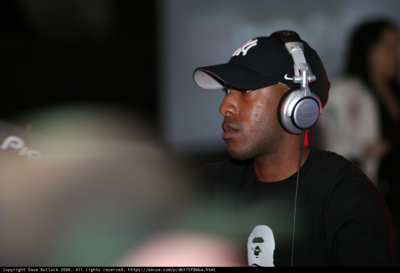Black Shirted Man with Baseball Cap