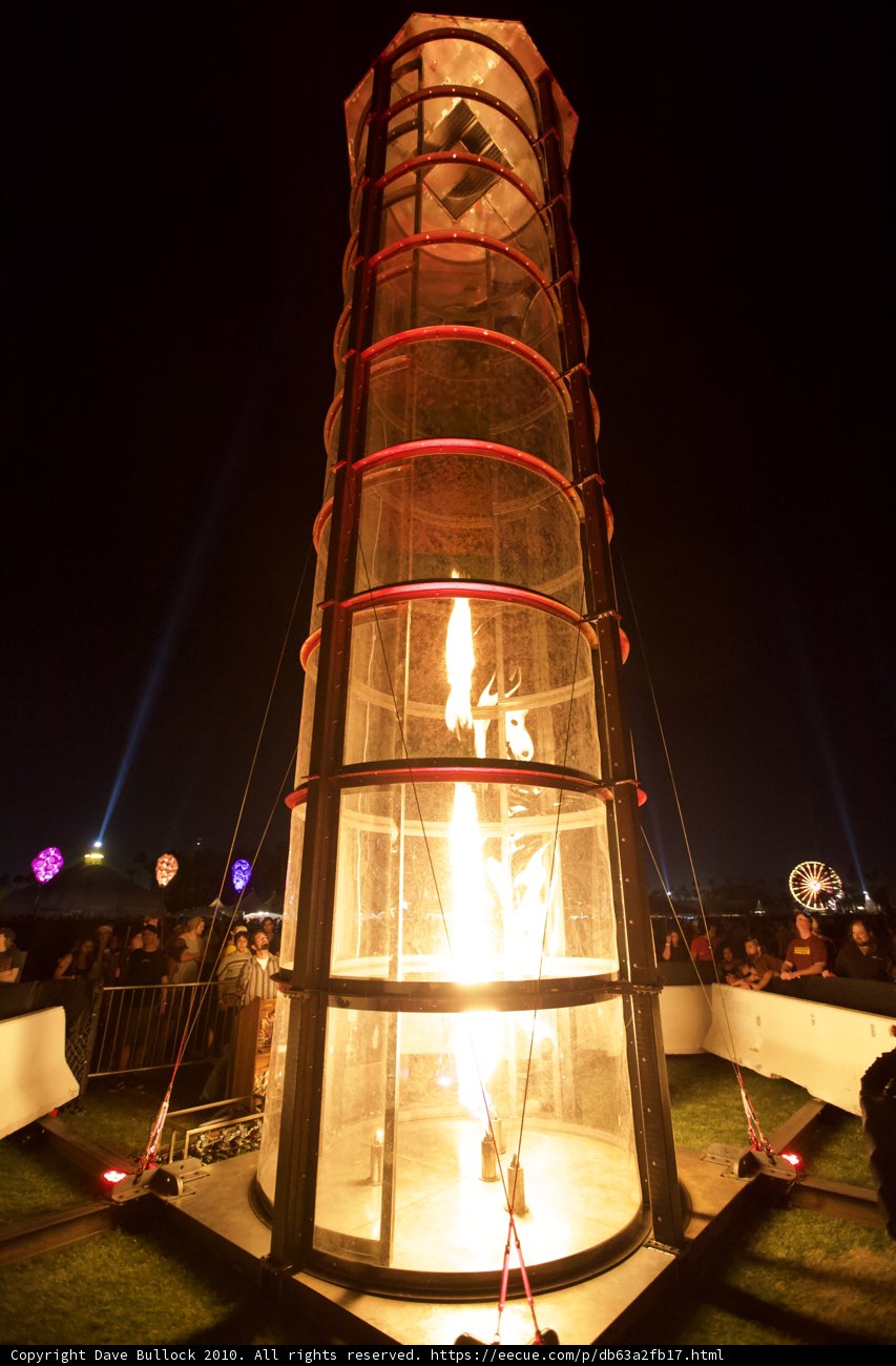 Tower Engulfed in Flames at Night