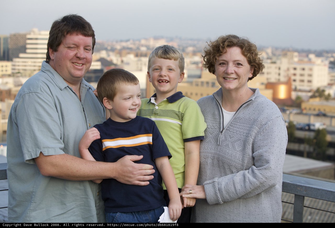 Family Portrait on Urban Rooftop at Dusk