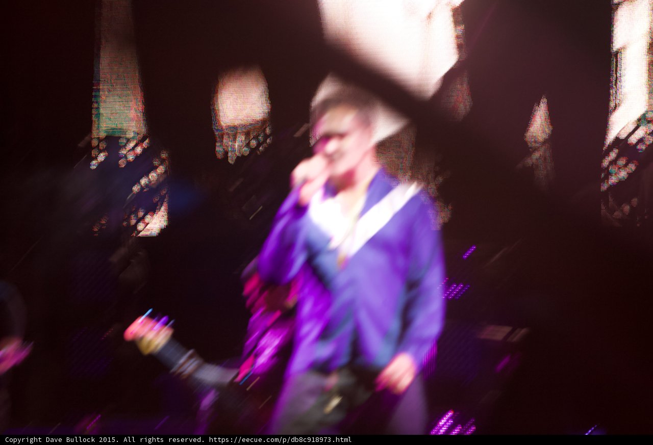 Morrissey Motion Blur Singing Blue Shirt Smiths Dangling Hands Screen Purple Lighting Impressionistic
