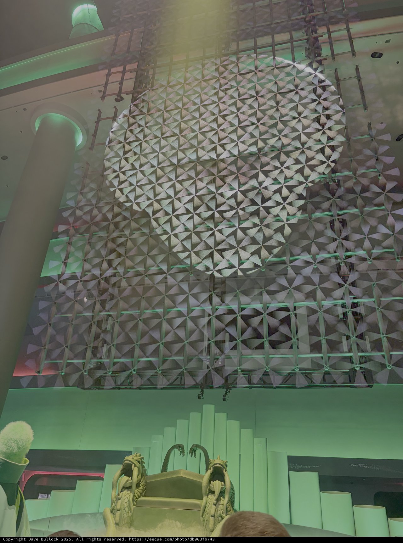 Futuristic Geometric Ceiling Installation with Green Lighting