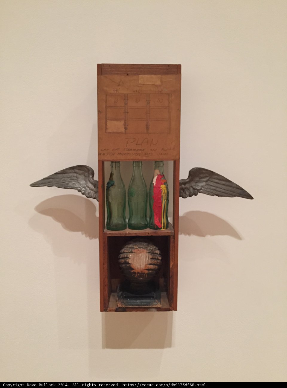 The Wooden Box with a Bird and a Bottle