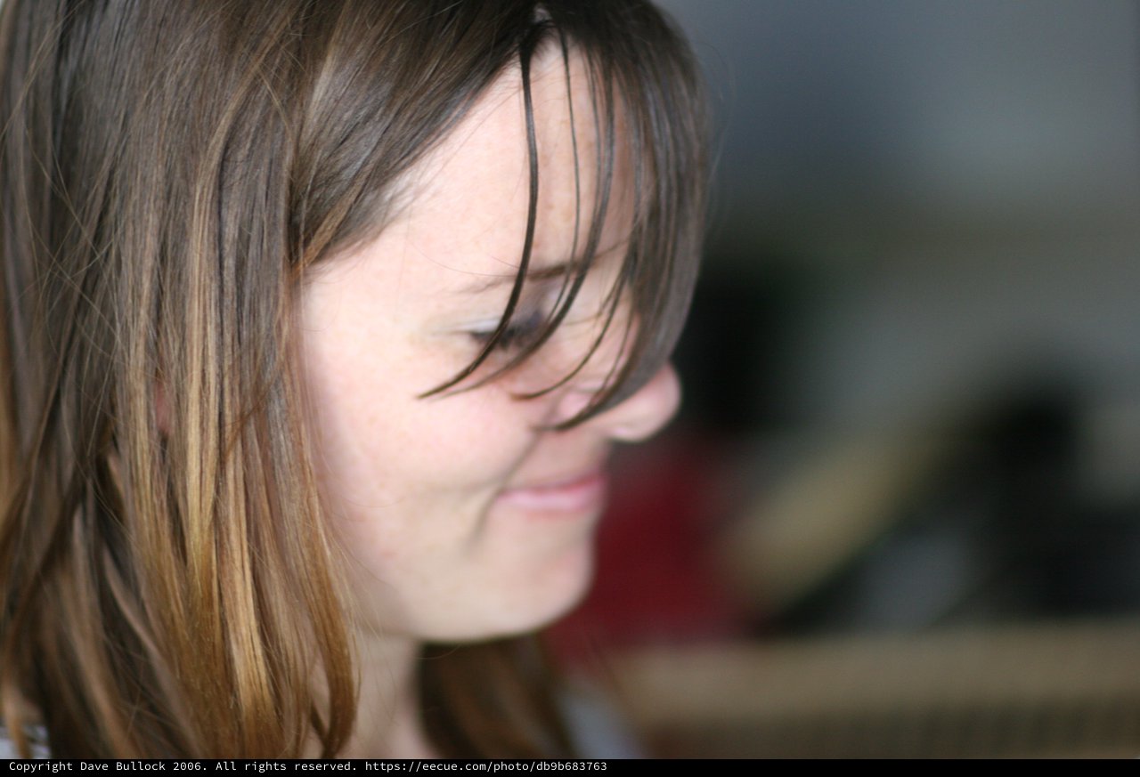 Windswept Hair Across a Gentle Smile