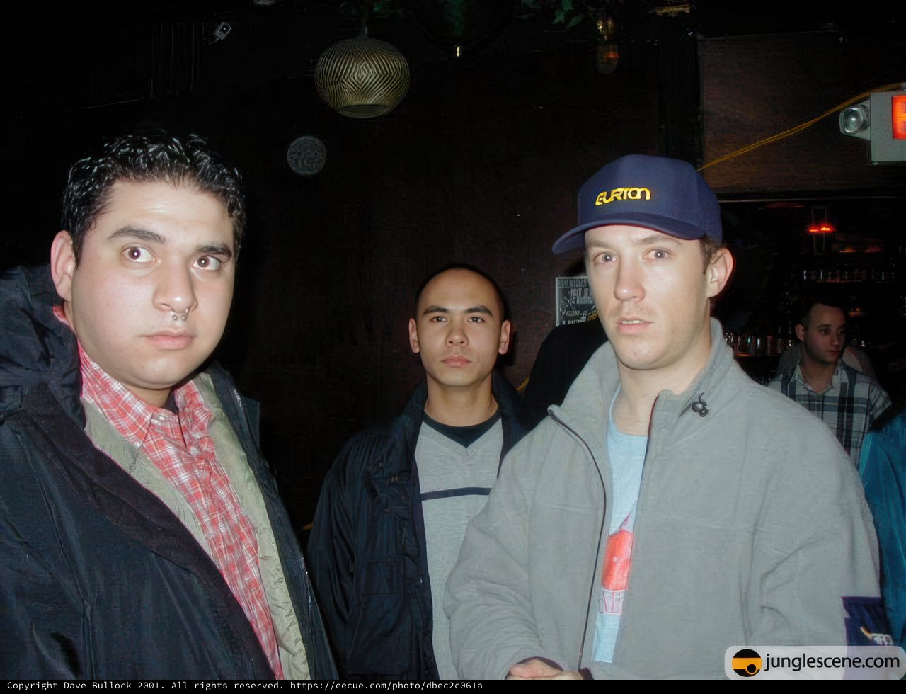 Man in Black Jacket Photobombed by Friends