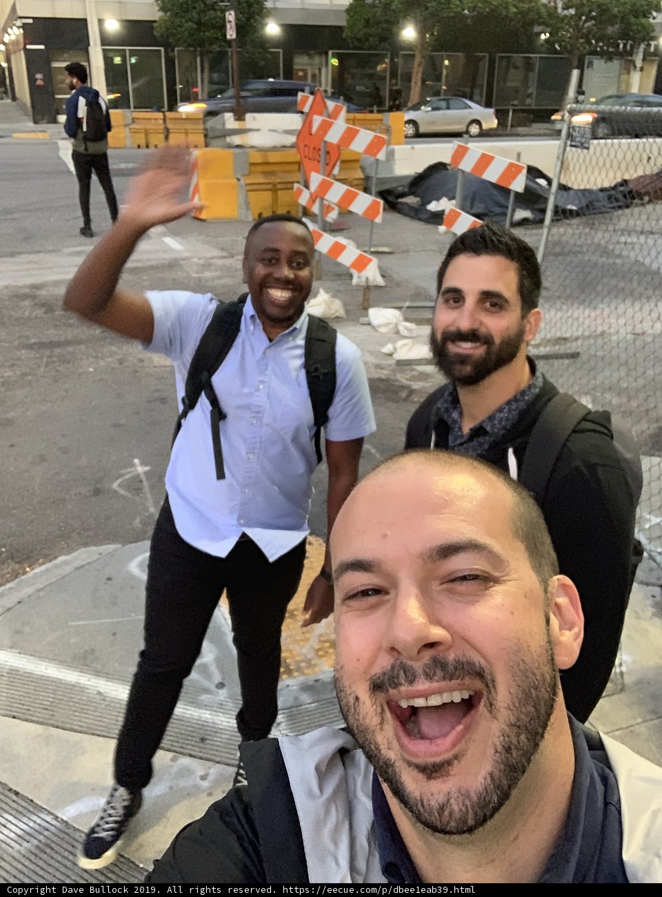 Three Men Taking a Selfie in Front of Construction Barriers in San Francisco