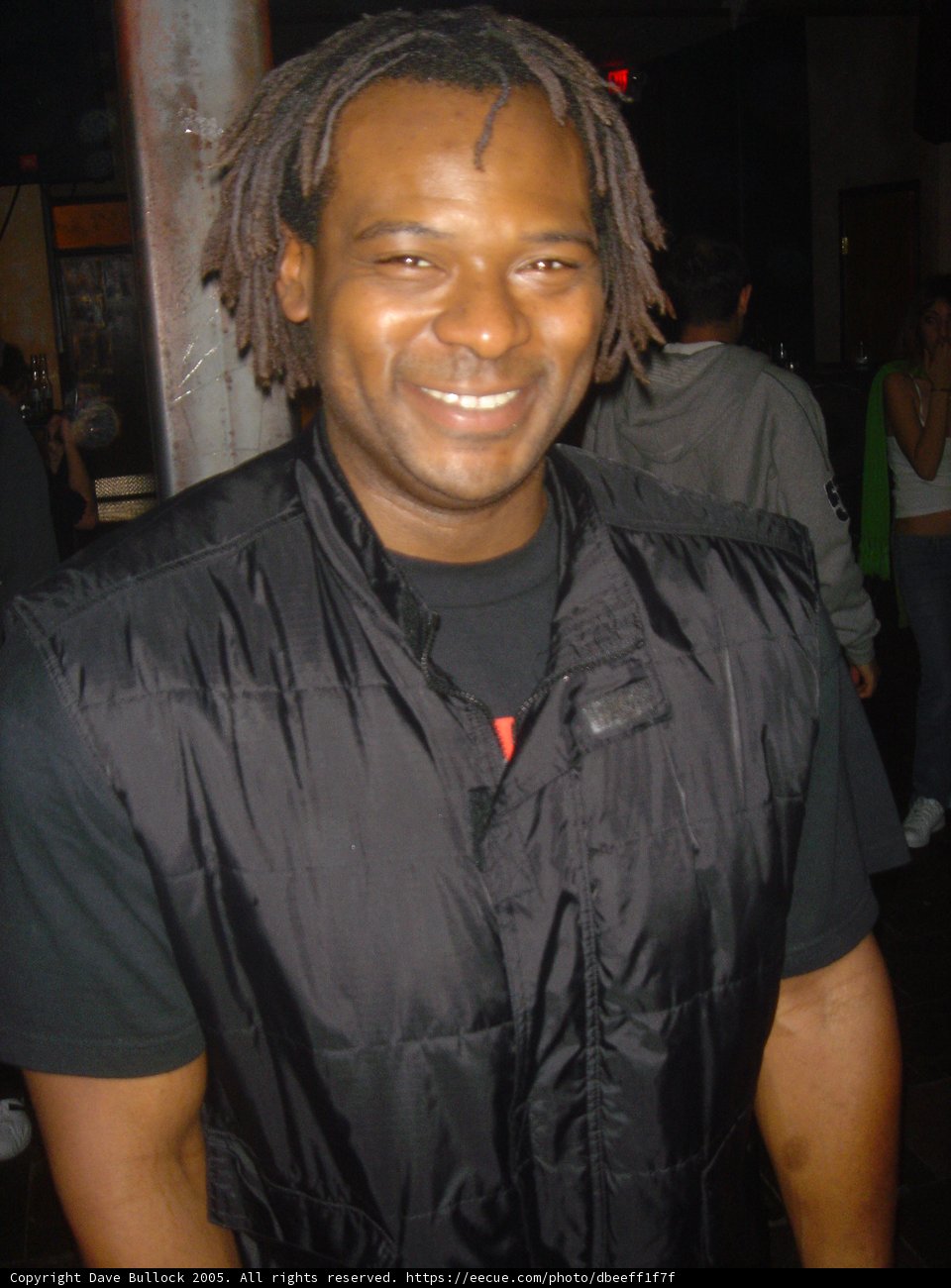 The Dreadlocked Man in His Winter Coat