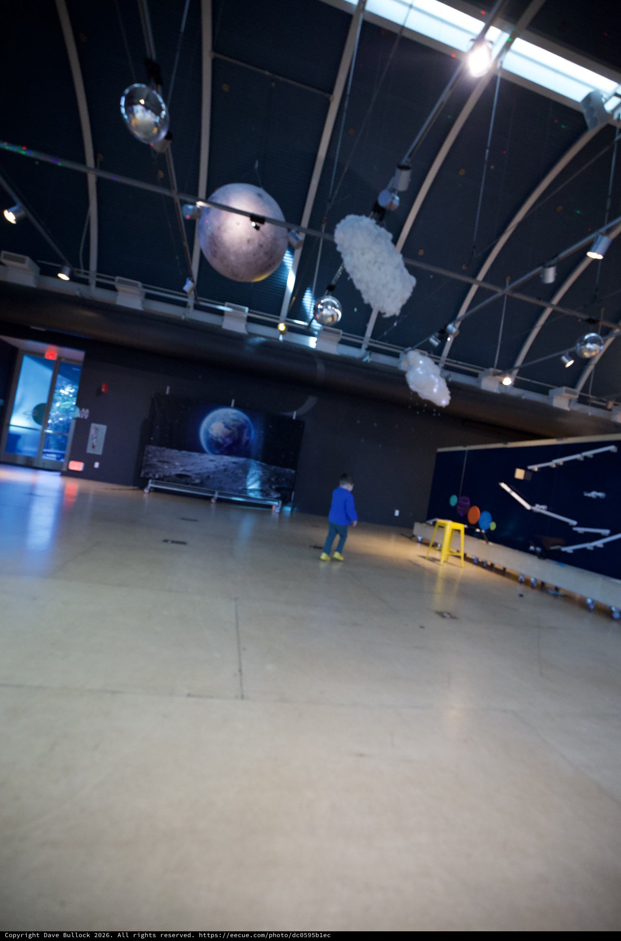 Child Explores Planetary Exhibition at Science Museum