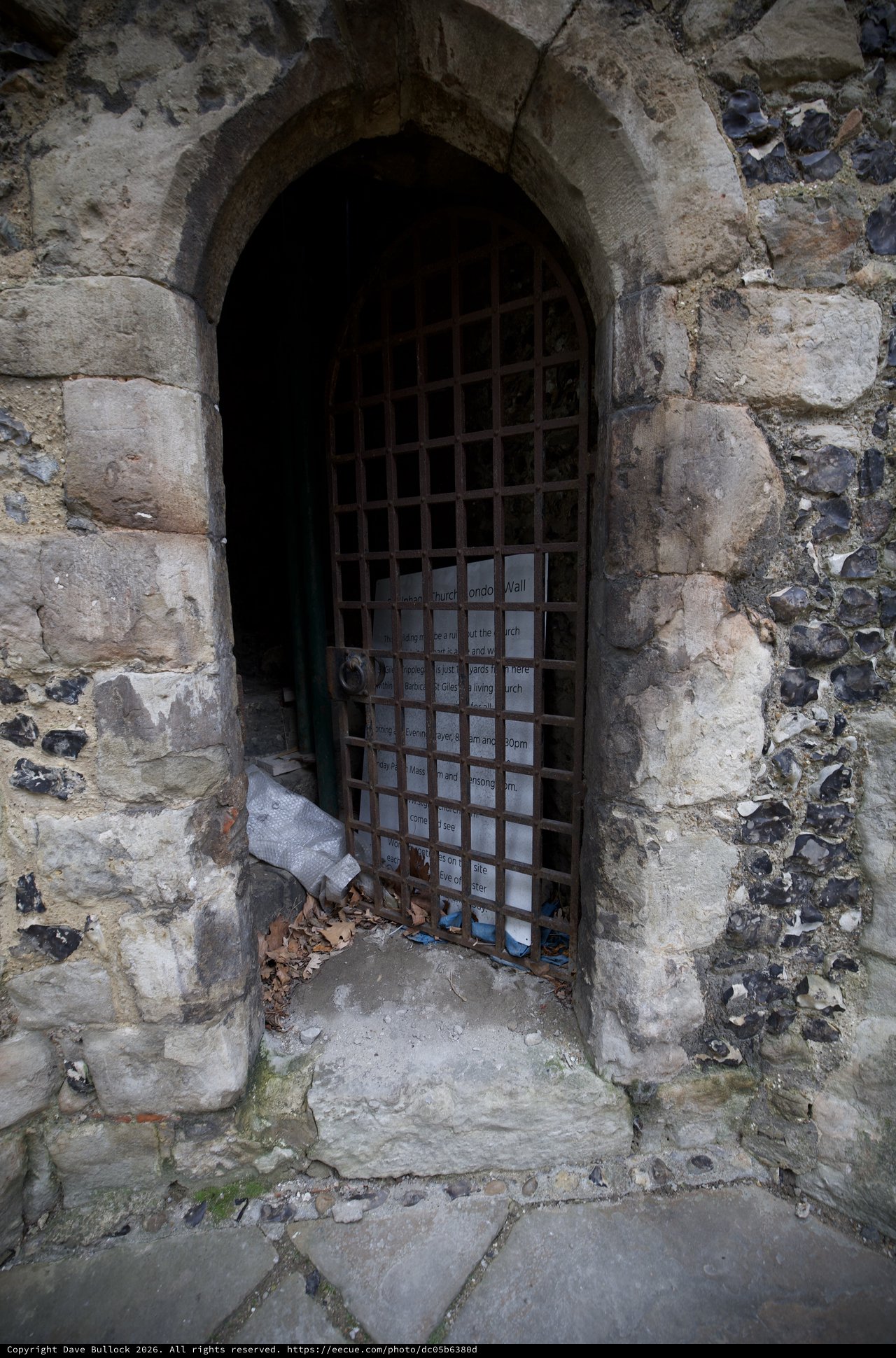 Ancient Stone Archway with Iron Portcullis Gate