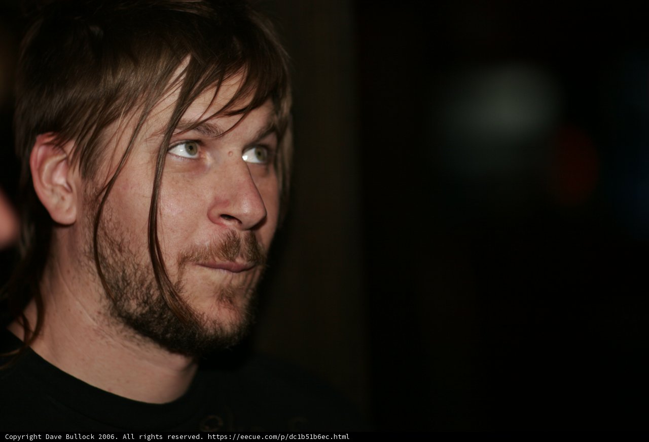 Bearded Man Gazes Up in Thought
