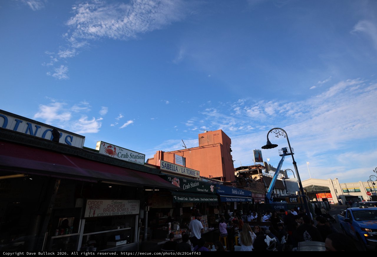 Bustling Fisherman's Wharf Seafood Market at Dusk