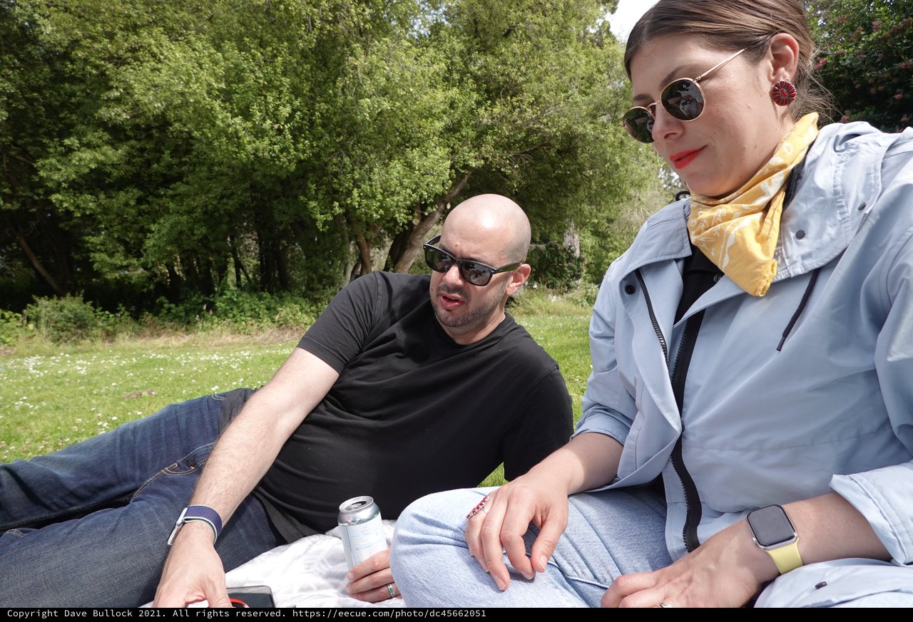 Couple Relaxing in Sunny Park Setting