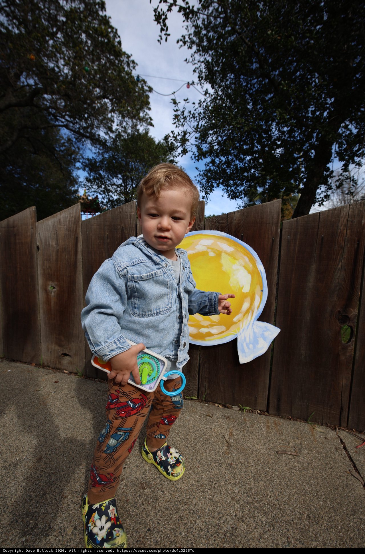 Toddler Playing with Toy Fishing Set in Backyard