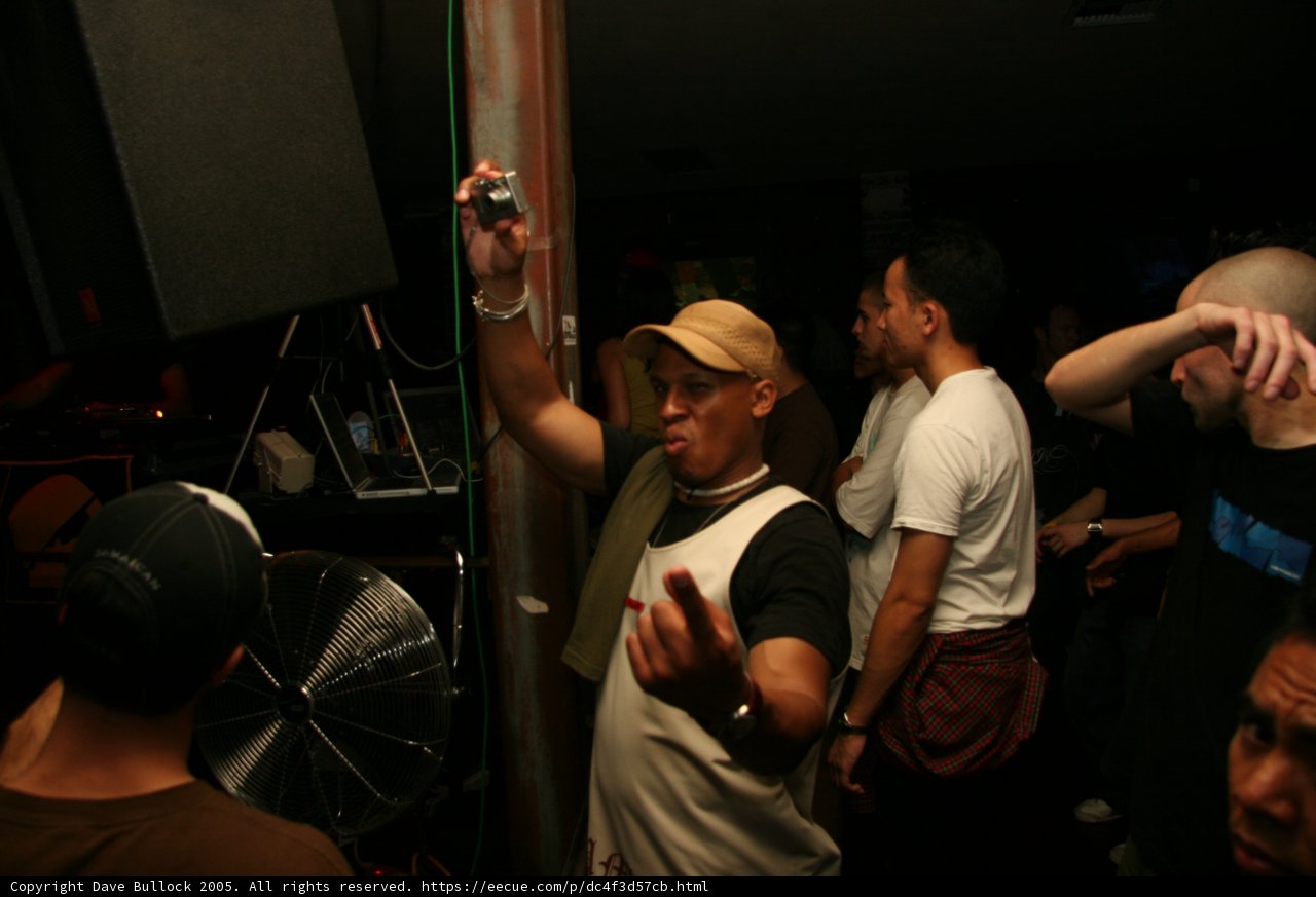 Man in baseball cap controls the crowd